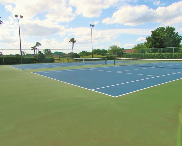 view of sport court featuring community basketball court and fence