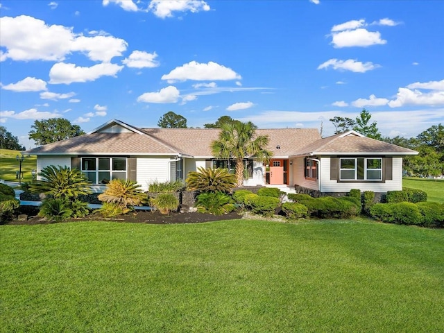 single story home with a front lawn