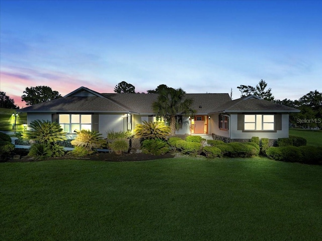 ranch-style home with a front yard