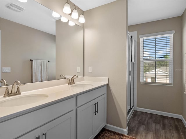 full bathroom featuring a sink, visible vents, and baseboards