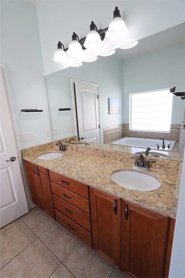 bathroom featuring a sink, a garden tub, double vanity, and tile patterned floors