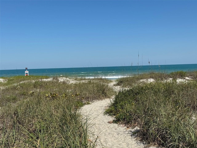 property view of water featuring a beach view