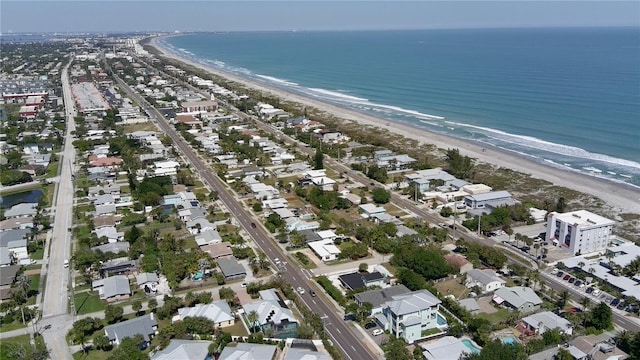 bird's eye view with a water view and a view of the beach