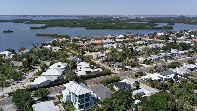 drone / aerial view featuring a residential view and a water view