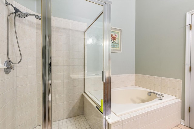 full bathroom featuring a stall shower and a bath