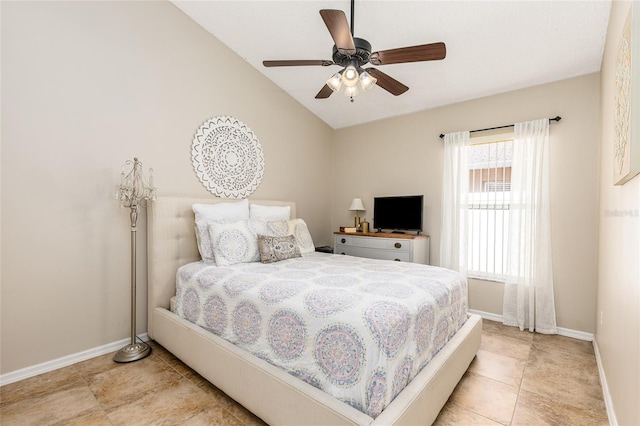 bedroom with baseboards, lofted ceiling, and a ceiling fan