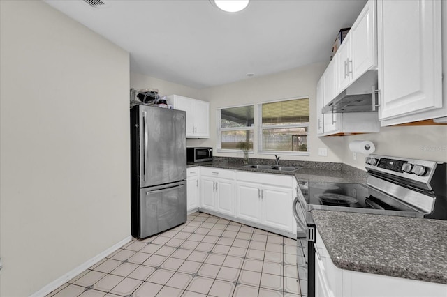 kitchen with baseboards, under cabinet range hood, white cabinets, stainless steel appliances, and a sink