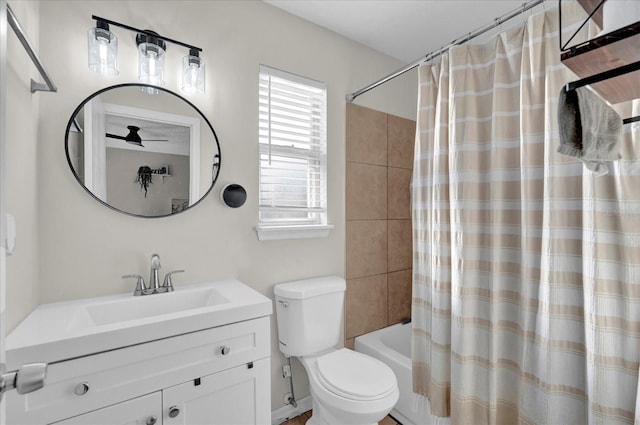 bathroom featuring shower / bathtub combination with curtain, toilet, and vanity