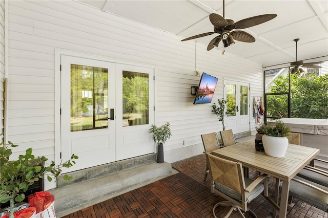 sunroom / solarium with french doors and ceiling fan