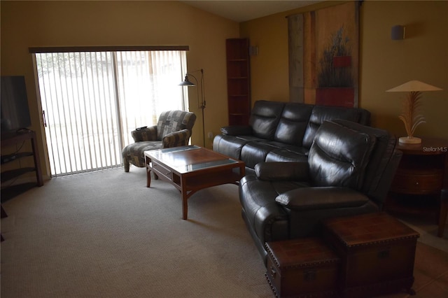 living area with lofted ceiling and carpet flooring