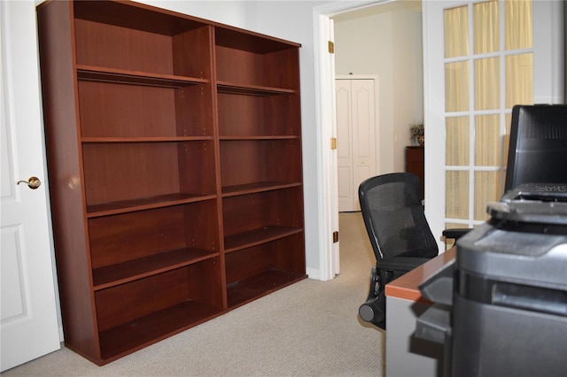 unfurnished office featuring carpet flooring