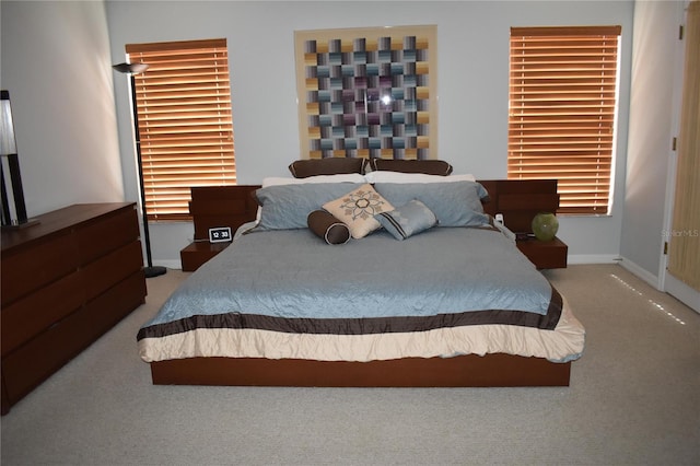 carpeted bedroom with baseboards