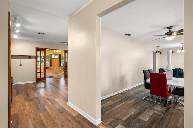 dining area with visible vents, a ceiling fan, and wood finished floors