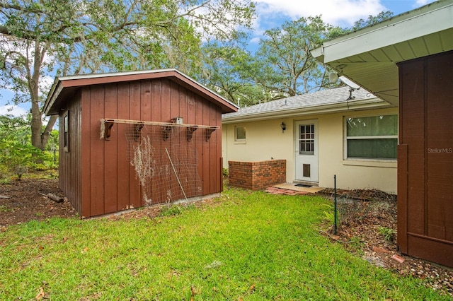 view of yard with a storage shed and an outdoor structure