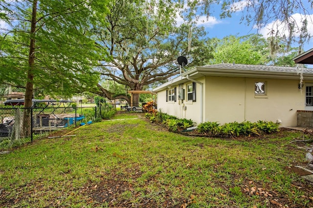 view of yard featuring fence