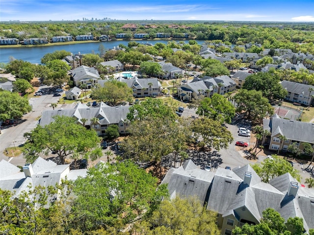 bird's eye view featuring a water view and a residential view