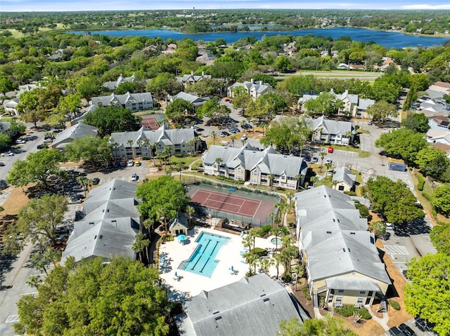 birds eye view of property with a water view and a residential view