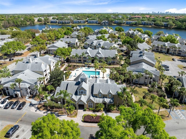 bird's eye view with a water view and a residential view