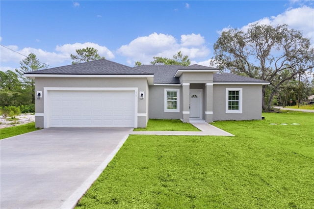 view of front facade with stucco siding, driveway, a front lawn, roof with shingles, and a garage