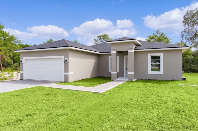 view of front facade featuring stucco siding, a garage, and a front lawn