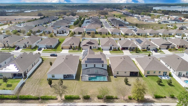 birds eye view of property with a residential view