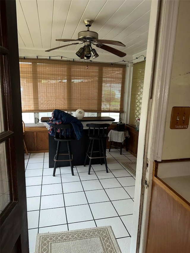 sunroom with a ceiling fan