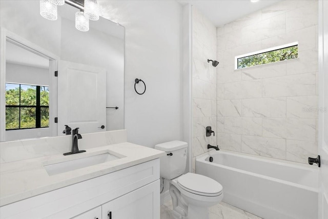 full bathroom featuring shower / bathing tub combination, toilet, marble finish floor, and vanity