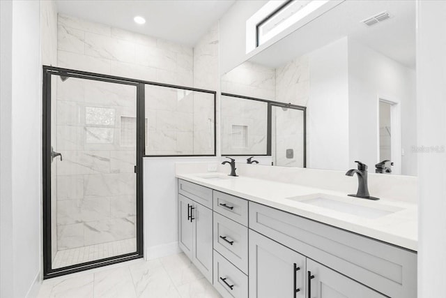 bathroom with a sink, visible vents, marble finish floor, and a shower stall