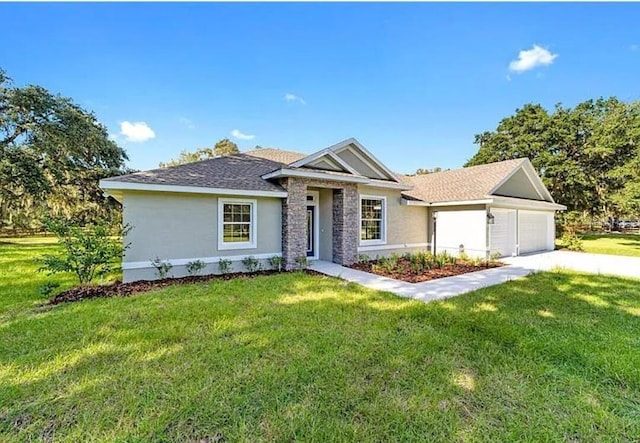 single story home with stucco siding, driveway, a front lawn, a shingled roof, and a garage