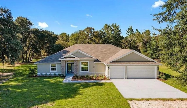 view of front of property with stucco siding, driveway, an attached garage, and a front yard