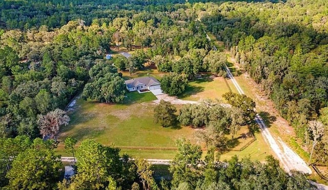 drone / aerial view with a forest view and a rural view