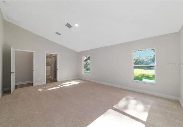 unfurnished bedroom featuring light colored carpet, visible vents, and baseboards