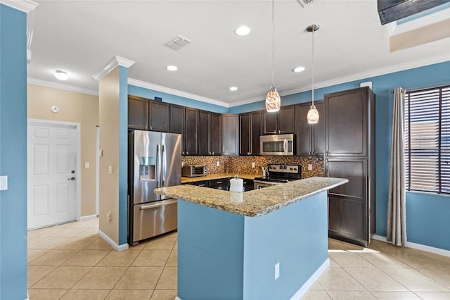 kitchen with light tile patterned floors, dark brown cabinetry, appliances with stainless steel finishes, and decorative backsplash