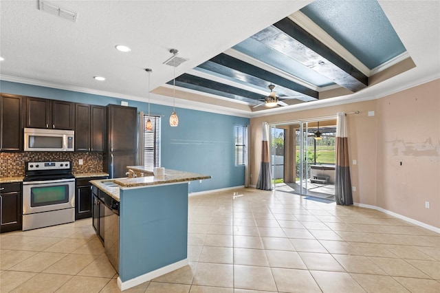 kitchen with light tile patterned floors, ceiling fan, decorative backsplash, stainless steel appliances, and crown molding