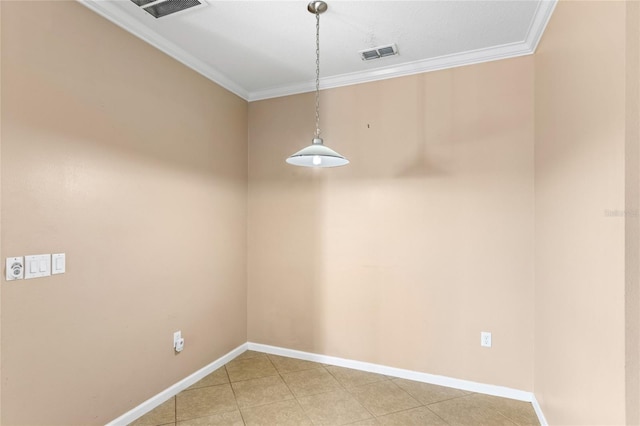 unfurnished room with crown molding, baseboards, and visible vents