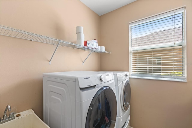 washroom featuring independent washer and dryer and laundry area