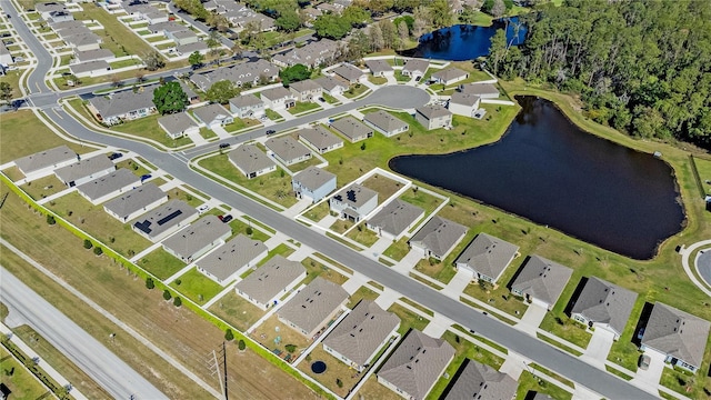 aerial view with a water view and a residential view