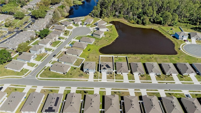 aerial view with a residential view and a water view