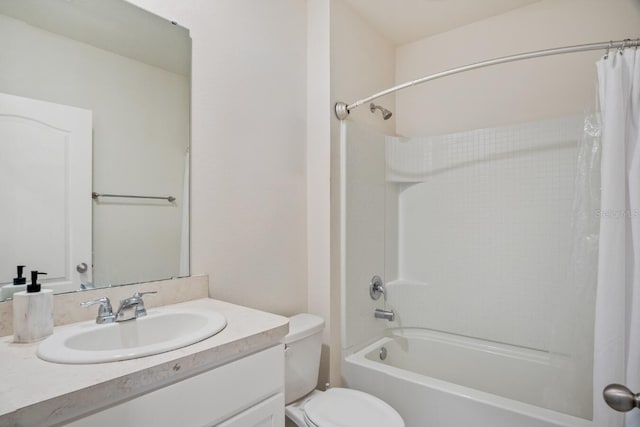 bathroom with toilet, vanity, and shower / bath combination with curtain