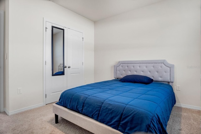 bedroom featuring baseboards and carpet floors