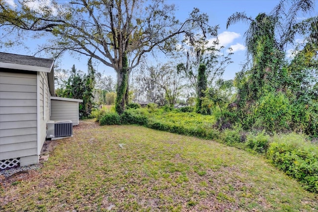 view of yard with central AC unit