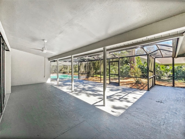 view of patio / terrace with ceiling fan, an outdoor pool, and a lanai