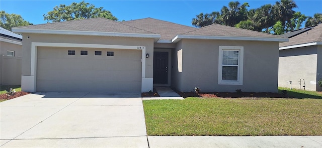 single story home with driveway, a shingled roof, stucco siding, a front lawn, and a garage