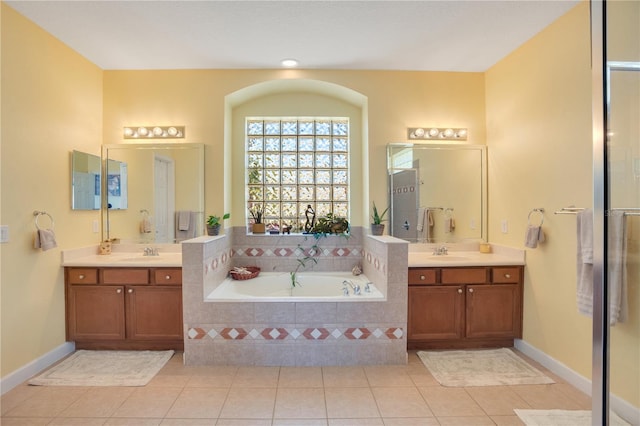 bathroom featuring a sink, two vanities, and tile patterned flooring