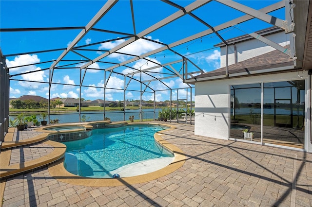 view of swimming pool with a lanai, a patio area, a water view, and a pool with connected hot tub