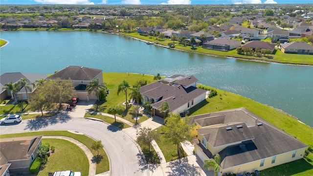 bird's eye view featuring a residential view and a water view