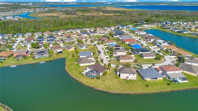 birds eye view of property featuring a residential view and a water view