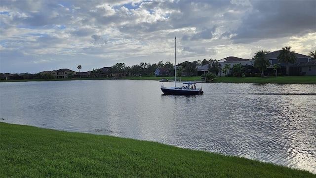 water view featuring a residential view and a dock