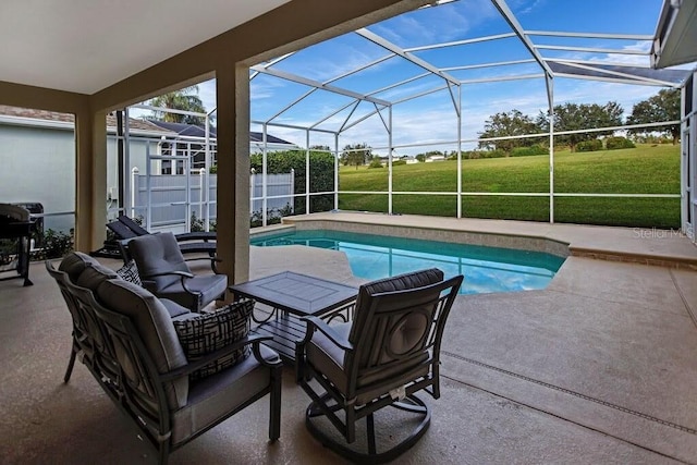 view of pool featuring glass enclosure, a patio, a lawn, and a fenced in pool