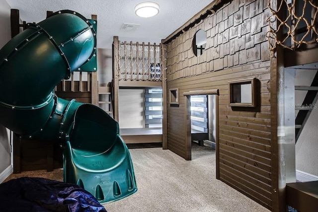 bathroom with visible vents and a textured ceiling